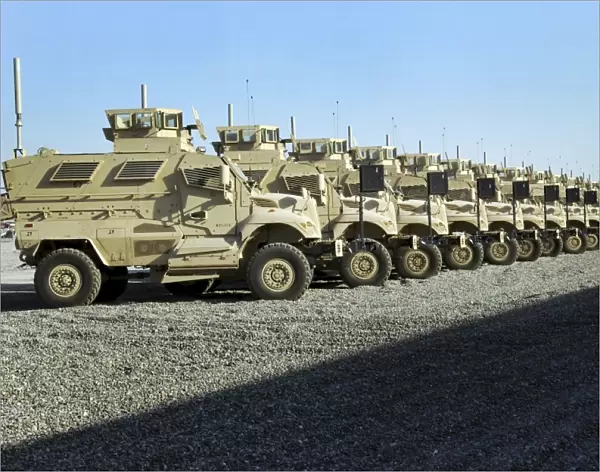 MaxxPro Mine Resistant Ambush Protected vehicles sit at Camp Liberty