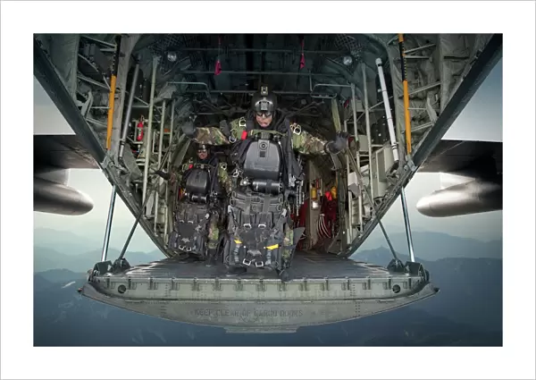 U. S. Navy SEALs combat diver prepares for HALO jump operations from a C-130 Hercules