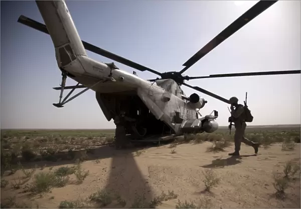 U. S. Marines board a CH-53D Sea Stallion helicopter in Afghanistan