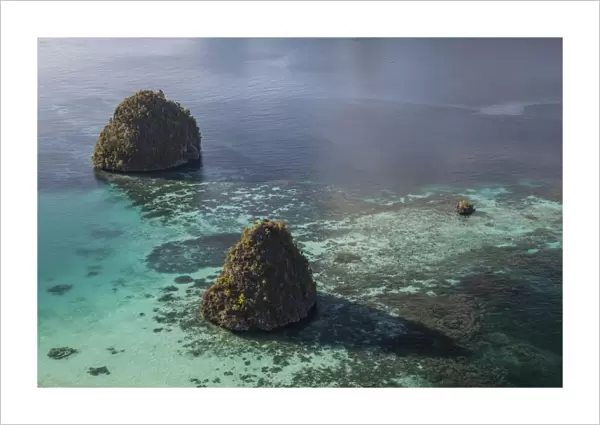Limestone islands surrounded by a coral reef in Raja Ampat