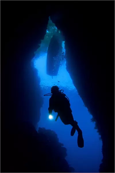 A diver explores an underwater cavern known as th Bat Cave, Solomons