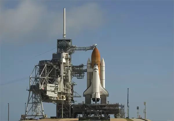 Space Shuttle Discovery sits ready on the launch pad at Kennedy Space Center