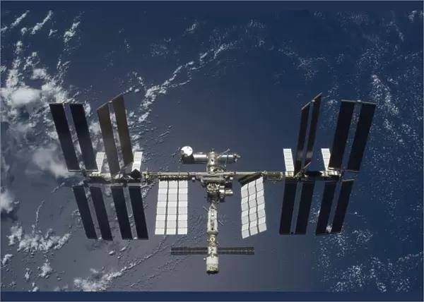 The International Space Station, backdropped by a blue and white Earth