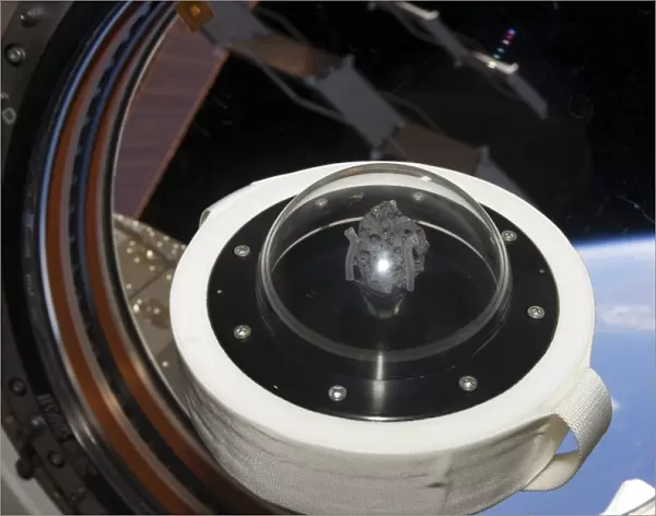 A moon rock floats aboard the International Space Station