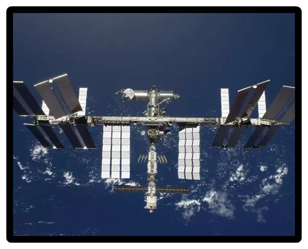 The International Space Station, backdropped by a blue and white Earth