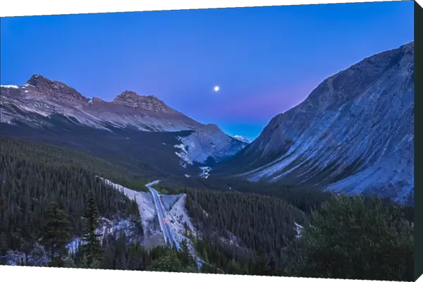 Moon over Icefields Parkway in Alberta, Canada