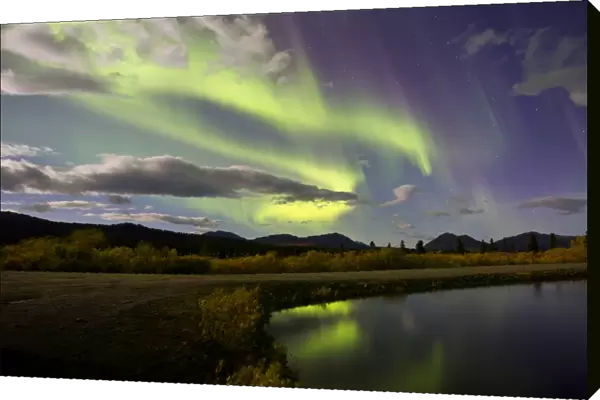 Aurora borealis with moonlight at Fish Lake, Yukon, Canada