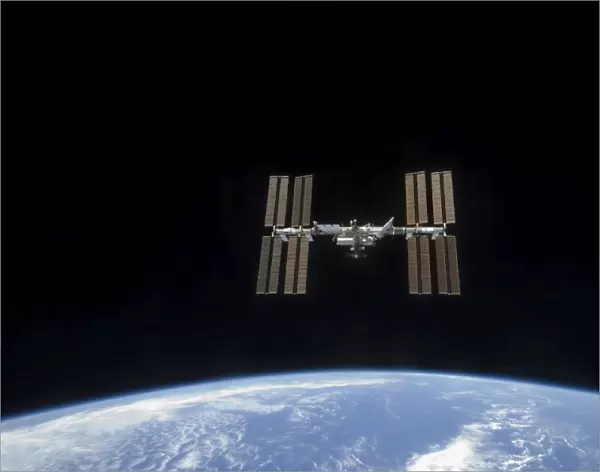 The International Space Station backdropped by Earths horizon