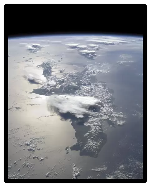 A panoramic view of the island of Hispaniola in the foreground and Cuba extending