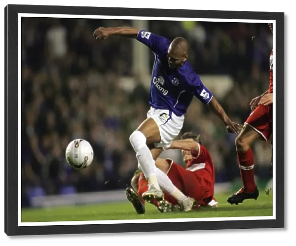 Marcus Bent vs. Nemeth: A Tight Tackle in Everton Football Club