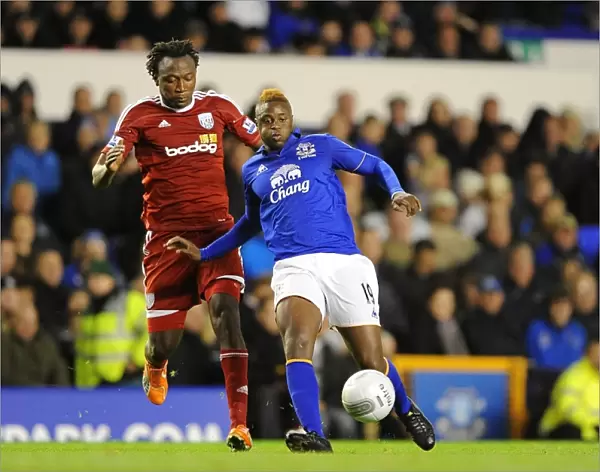 Magaye Gueye vs. Somen Tchoyi: A Football Battle for the Carling Cup Ball at Goodison Park (Everton vs. West Bromwich Albion, 21 September 2011)