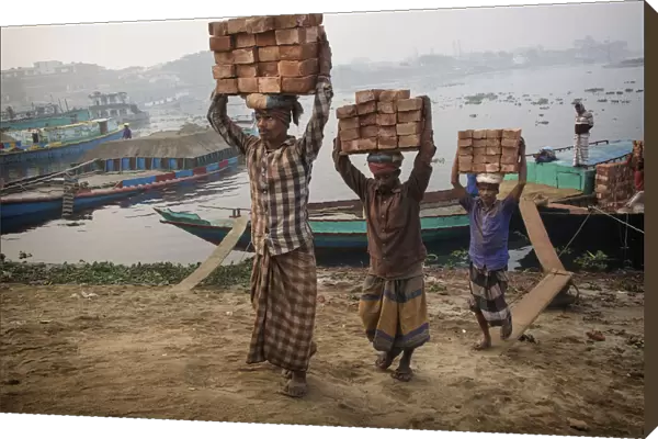 transporting bricks at Biruganga riverbank