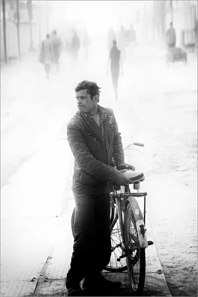 A man with his bicycle at morning, Allahabad