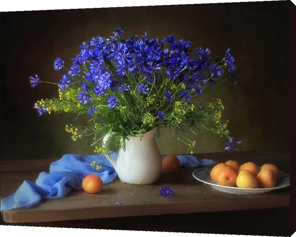 Still life with cornflowers and apricots