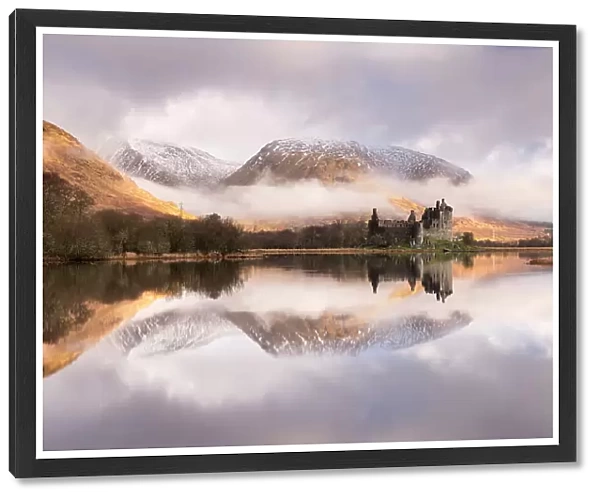 Kilchurn Castle, sunrise, early morning mist and light, a ruin on a rocky peninsula, the northeastern end of Loch Awe, in Argyll and Bute, Scotland, UK. March 2017