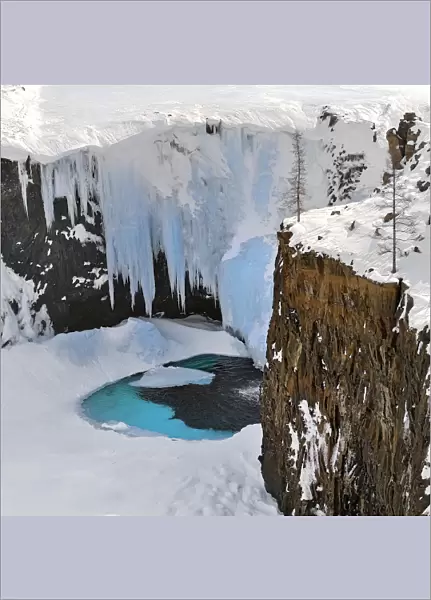 Frozen waterfall in Putoransky State Nature Reserve, Putorana Plateau, Siberia, Russia