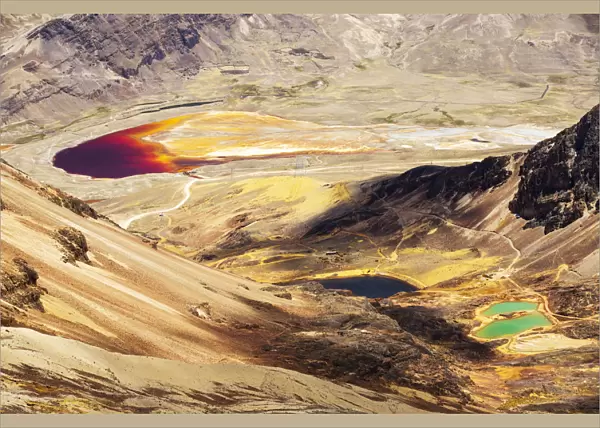 Colourful lakes below the peak of Chacaltaya, lake discoloured by mine effluent. Andes, Bolivia