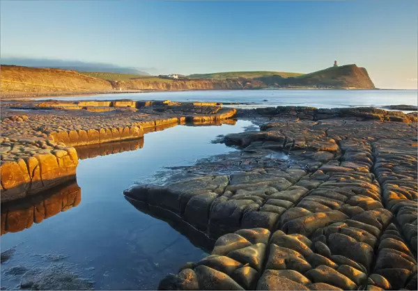 Rock formations at Kimmeridge Bay, Clavell Tower in background, Isle of Purbeck, Jurassic Coast