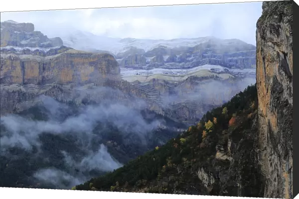 Mountain gorge filled with mist, Ordesa y Monte Perdido National Park, Huesca, Spain, October 2015
