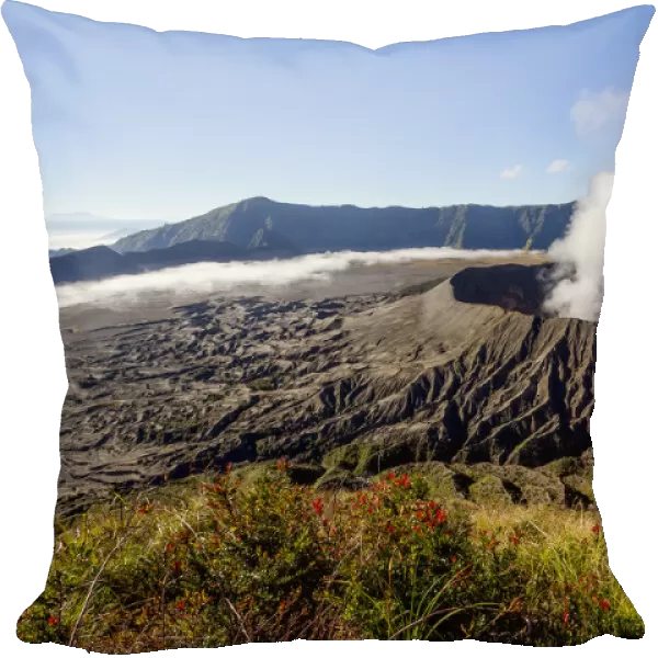 Smoke billowing from Mount Bromo volcano. View from the summit of Mount Batok