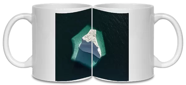 Iceberg showing submerged section when viewed from above, Greenlands National Park, Northeast Greenland. August 2015