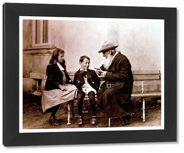 Leo Tolstoy, Russian writer, philosopher and mystic, telling his grandchildren a story, c1890-1910