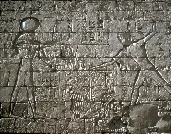 Rameses III smiting his enemies before Amun-Ra, Mortuary Temple, Medinat Habu, Egypt, c12th cen BC