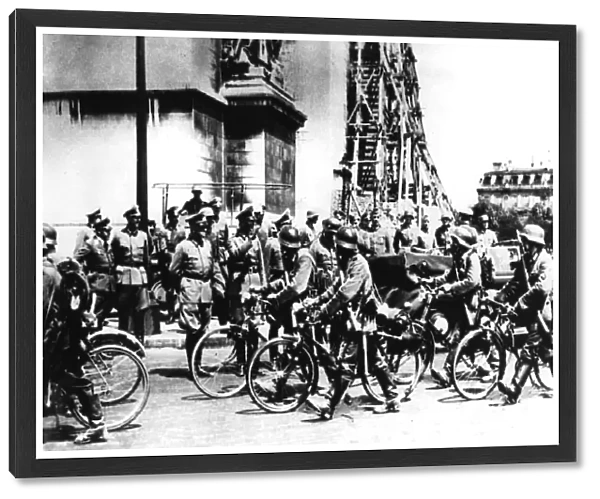 German soldiers marching past the Arc de Triomphe, Paris, 14 June 1940