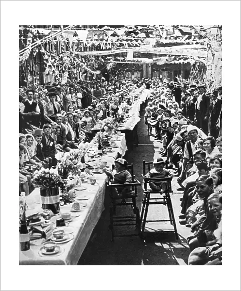 Jubilee tea party for children in Orville Road, Battersea, London, 1935
