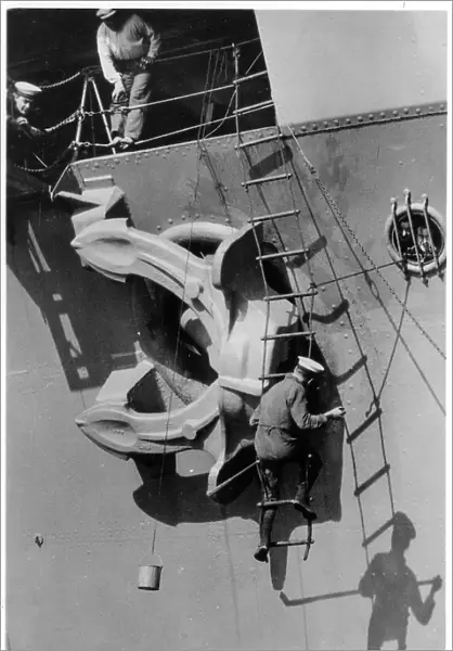 Painting the anchor of the aircraft carrier HMS Courageous, 1937