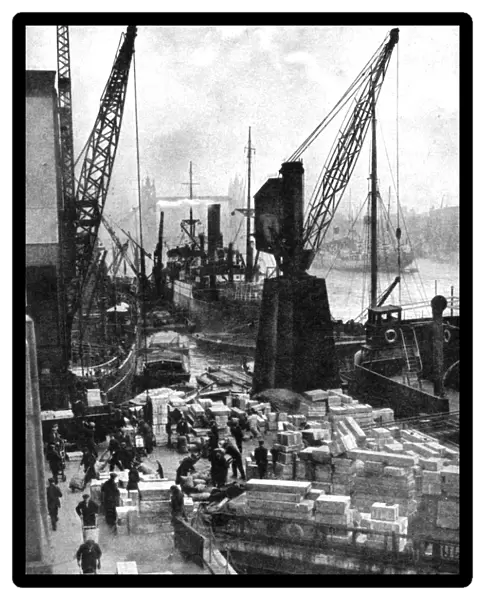 Cargo being unloaded at the docks, Upper Pool, London, 1936. Artist: Fox
