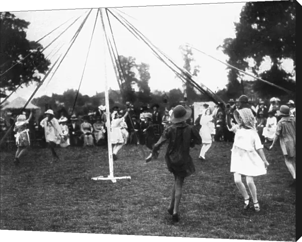 Children dancing round a maypole, 1926