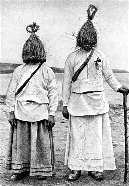 A pair of straw boys, Ireland, 1922. Artist: AW Cutler