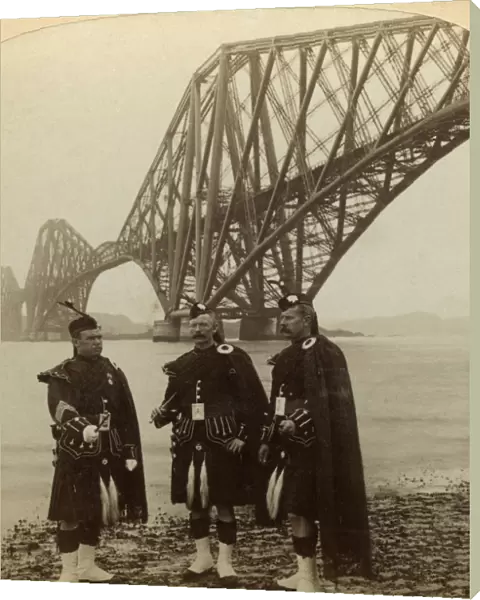 Men in Highland dress in front of the Forth Bridge, Scotland. Artist: Underwood & Underwood
