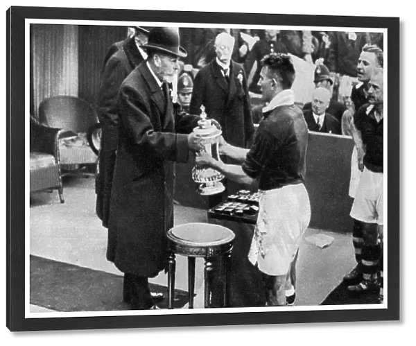 King George V presenting the FA Cup, Wembley Stadium, London, c1923-1936 (1937). Artist: Fox