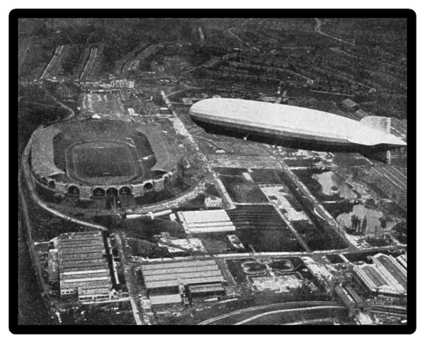 German airship Graf Zeppelin flying over Wembley during the FA Cup Final, London, 1930. Artist: Central Press