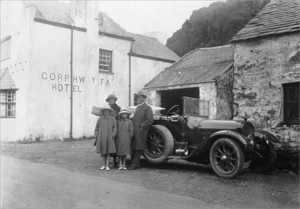 A family standing beside their car, Gorphwysfa Hotel, North Wales, c1920s-c1930s(?)