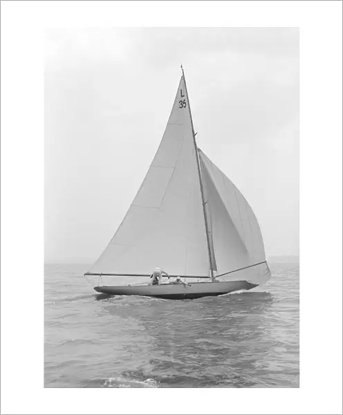The 6 Metre Lanka sailing with spinnaker, 1914. Creator: Kirk & Sons of Cowes