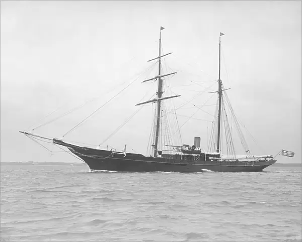 The auxiliary schooner Xarifa at anchor, 1912. Creator: Kirk & Sons of Cowes