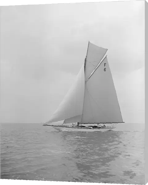 The 10 Metre class Eleda (F6) sailing close-hauled, 1913. Creator: Kirk & Sons of Cowes