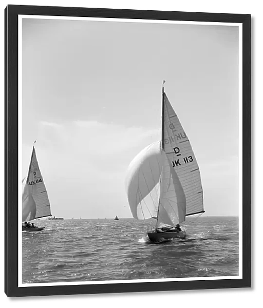 Sloop (Dragon? class) sailing with spinnaker, c1938. Creator: Kirk & Sons of Cowes