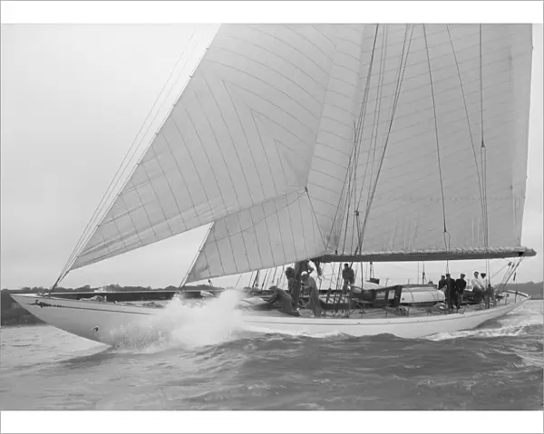 The cutter Minstrel competing in the round Island Race, 1938. Creator: Kirk & Sons of Cowes