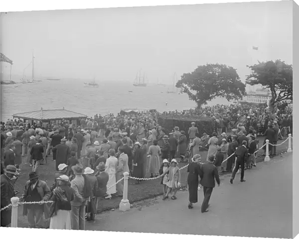 Spectators watching yachts at Cowes, Isle of Wight. Creator: Kirk & Sons of Cowes