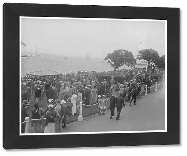Spectators watching yachts at Cowes, Isle of Wight. Creator: Kirk & Sons of Cowes