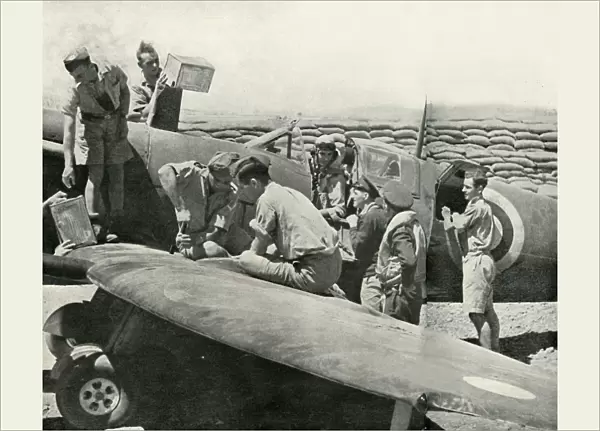 Refuelling and re-arming Spitfire fighters, Malta, World War II, 1942 (1944). Creator: Unknown