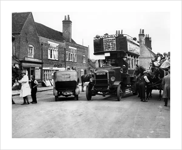 1920s Thornycroft J bus in busy street scene. Creator: Unknown