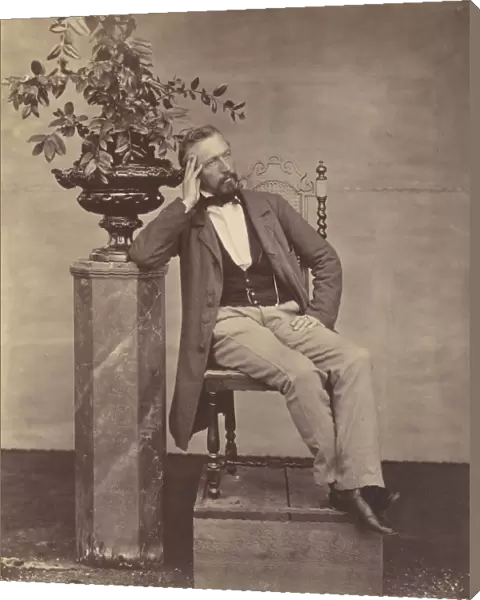 [Mathias Housermann seated with elbow on pedestal holding a vase of flowers]