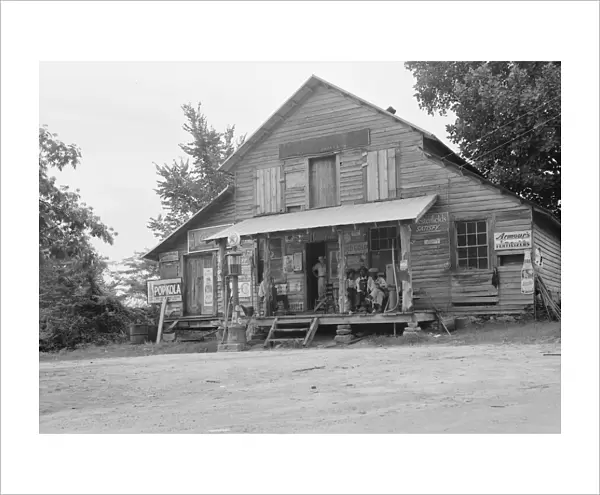Country store on dirt road, Sunday afternoon, near Gordenton, North Carolina, 1939. Creator: Dorothea Lange