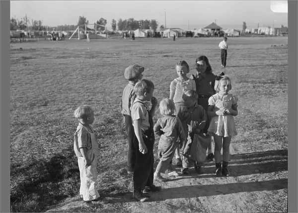 Children of migratory pea pickers in Brawley camp, California, 1939. Creator: Dorothea Lange