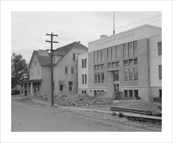 The new WPA courthouse alongside the old county courthouse, Bonners Ferry, Idaho, 1939. Creator: Dorothea Lange